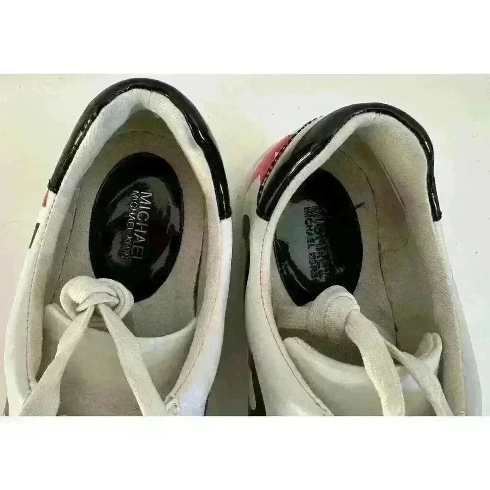 Michael Kors leather sneakers logo wrap around size. 7M  patent leather on back